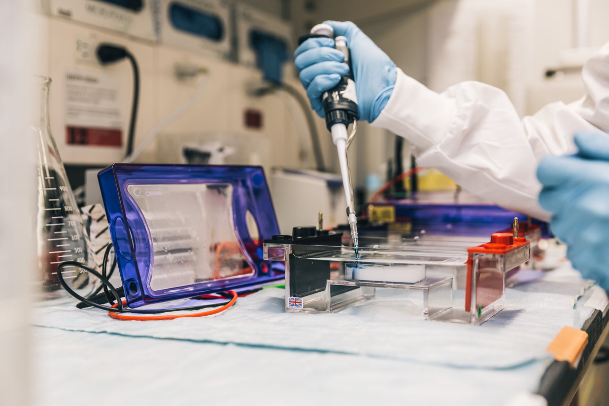 Scientist working in a laboratory with a pipette